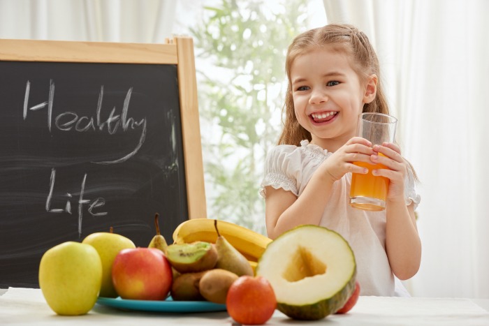 A beautiful girl drinking fresh juice