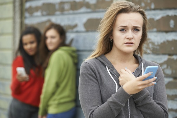 Teenage Girl Being Bullied By Text Message