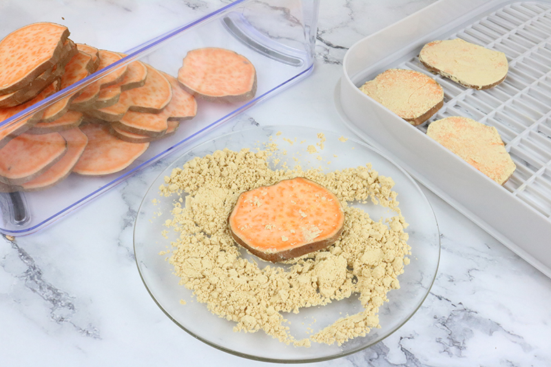 covering sweet potatoes with powdered peanut butter before sweet potato dog treats