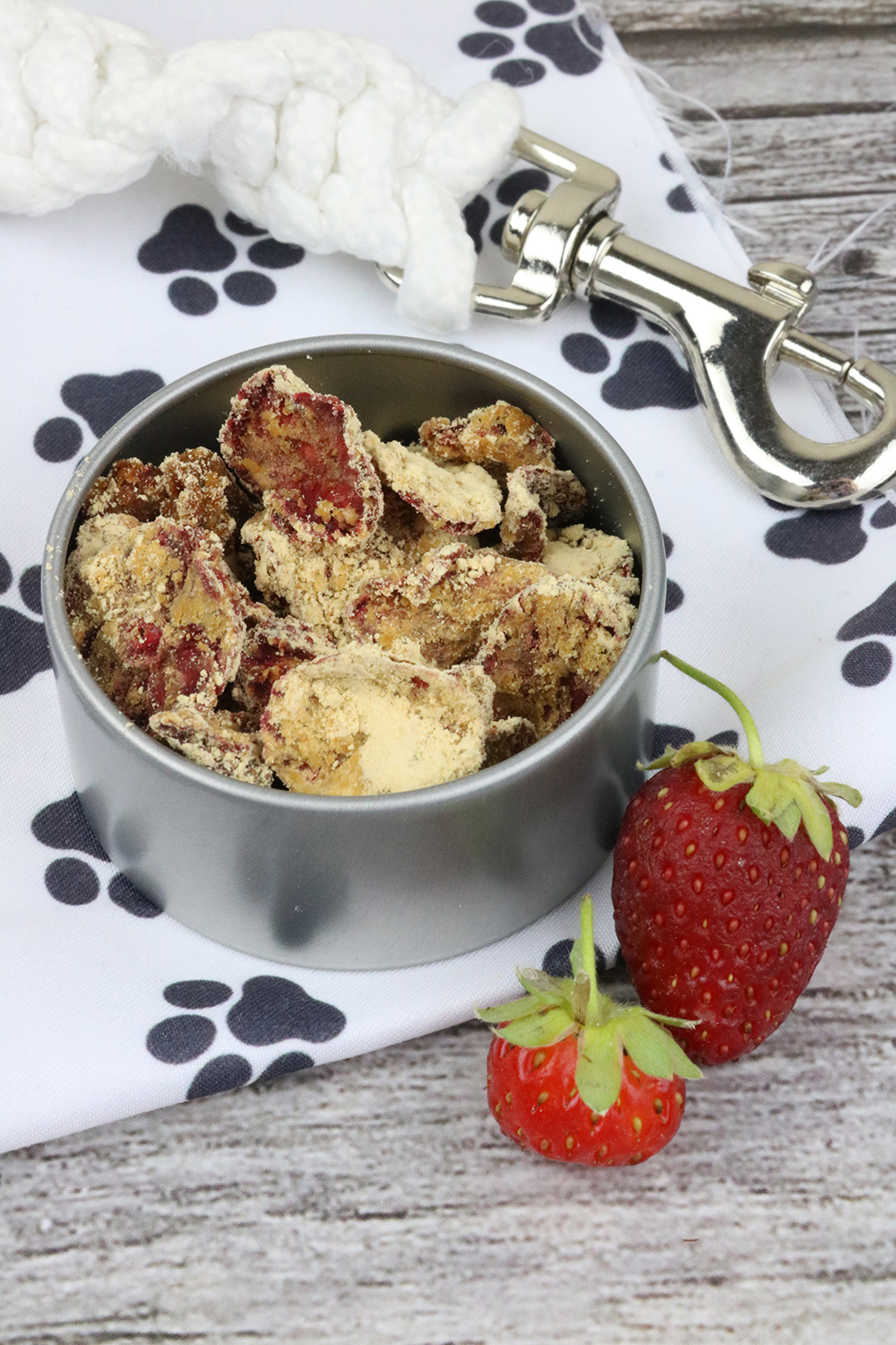 strawberry peanut butter dog treats in a metal dog bowl