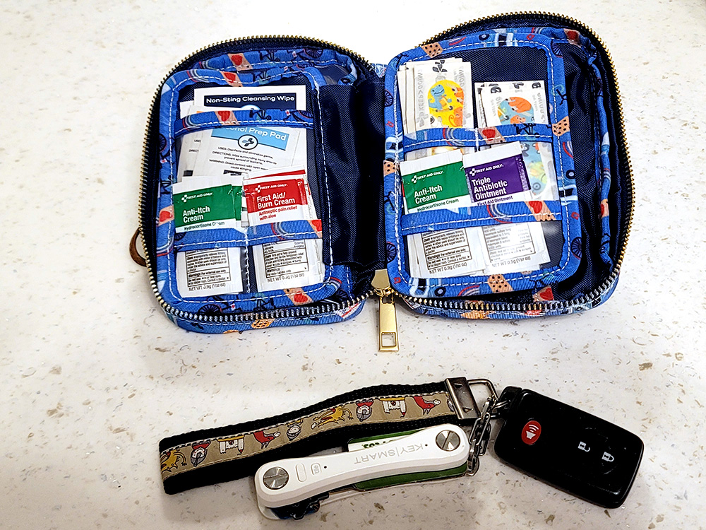 Inside first aid kit with comparison to keys