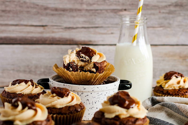 picture of a bitten into buckeye cupcake