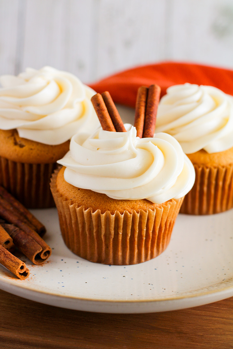 three pumpkin spice cupcakes