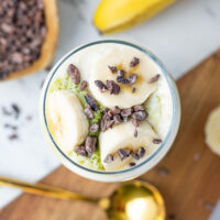 picture of a Banana Cream Matcha Latte ready to be served in a tall glass