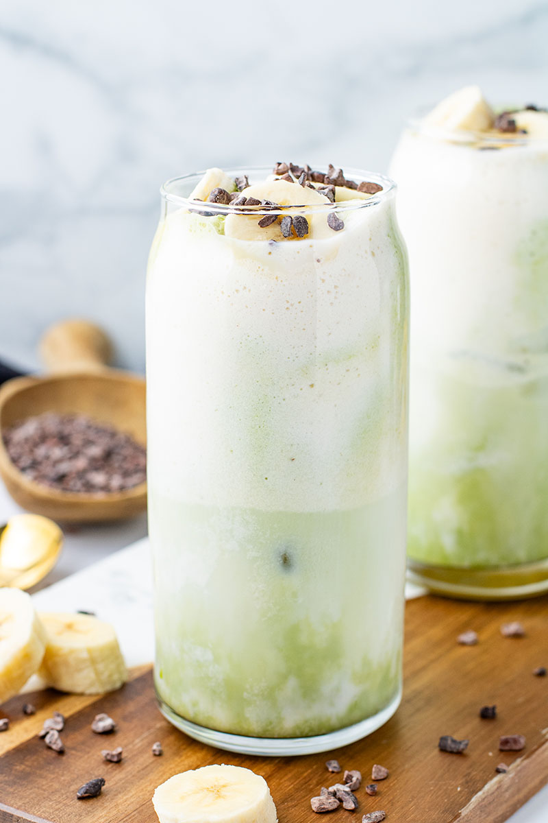 picture of a Banana Cream Matcha Latte ready to be served in a tall glass