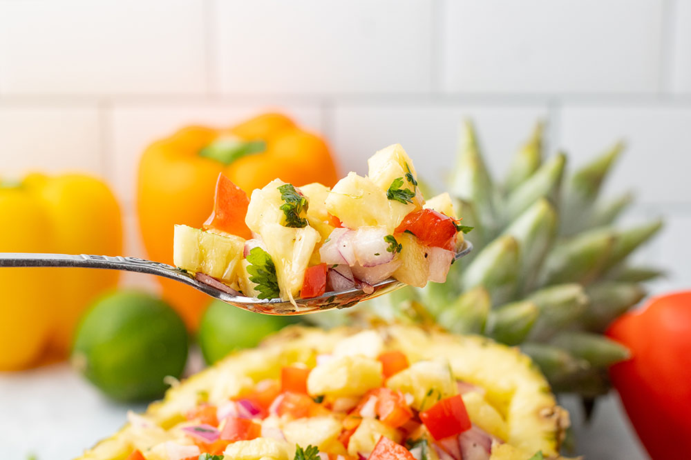 picture of pineapple salsa in a fresh pineapple