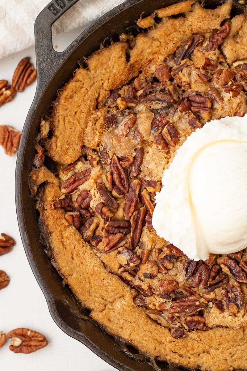 delicious homemade pecan pie cobbler in a cast iron pan