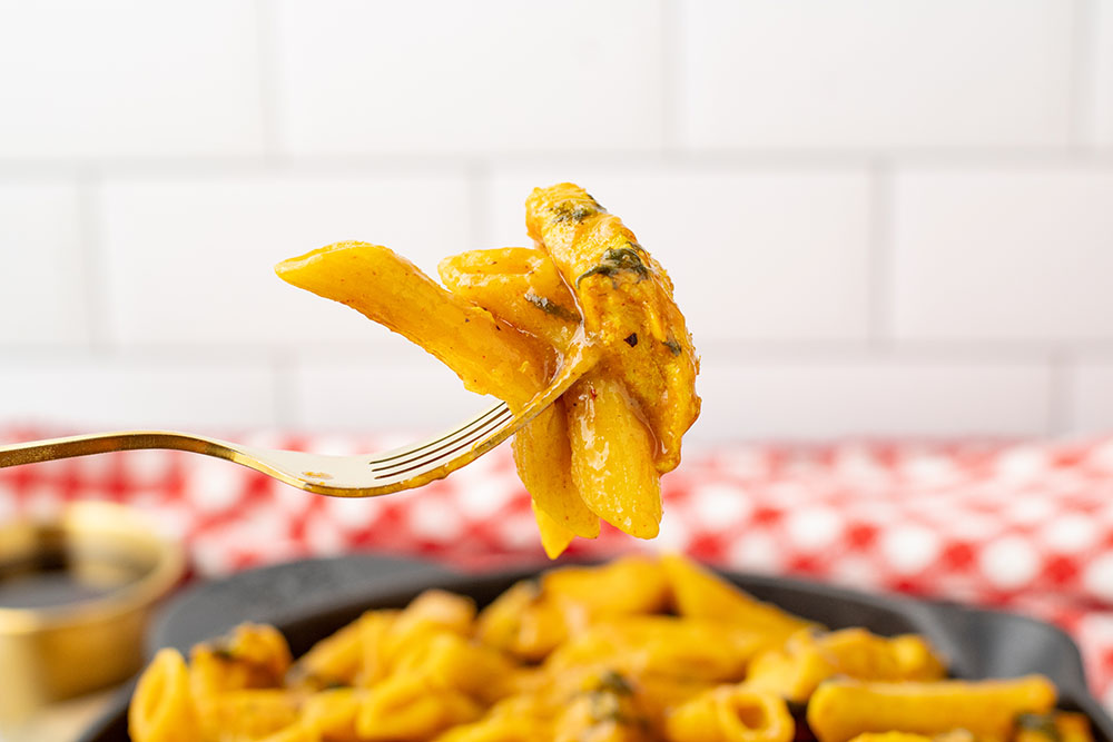 A bowl of maple chicken curry made in the Instant Pot but being served in a cast iron pan