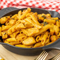 A bowl of maple chicken curry made in the Instant Pot but being served in a cast iron pan