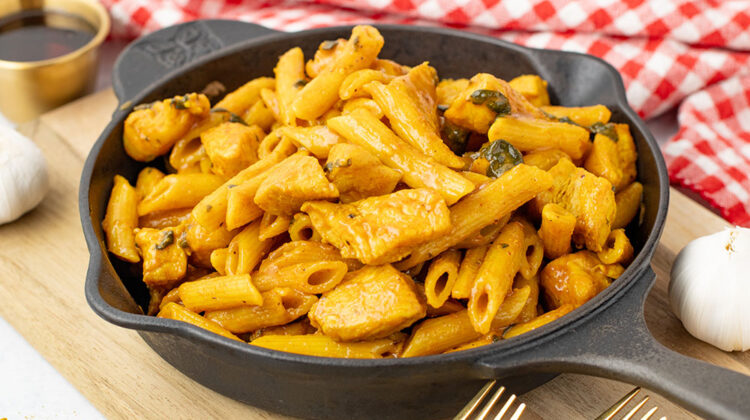 A bowl of maple chicken curry made in the Instant Pot but being served in a cast iron pan