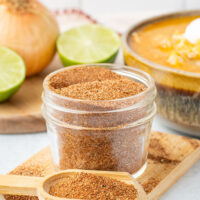 Picture of homemade Chili Seasoning Recipe next to a bowl of soup